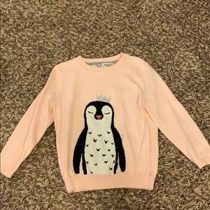 Pink penguin sweater.